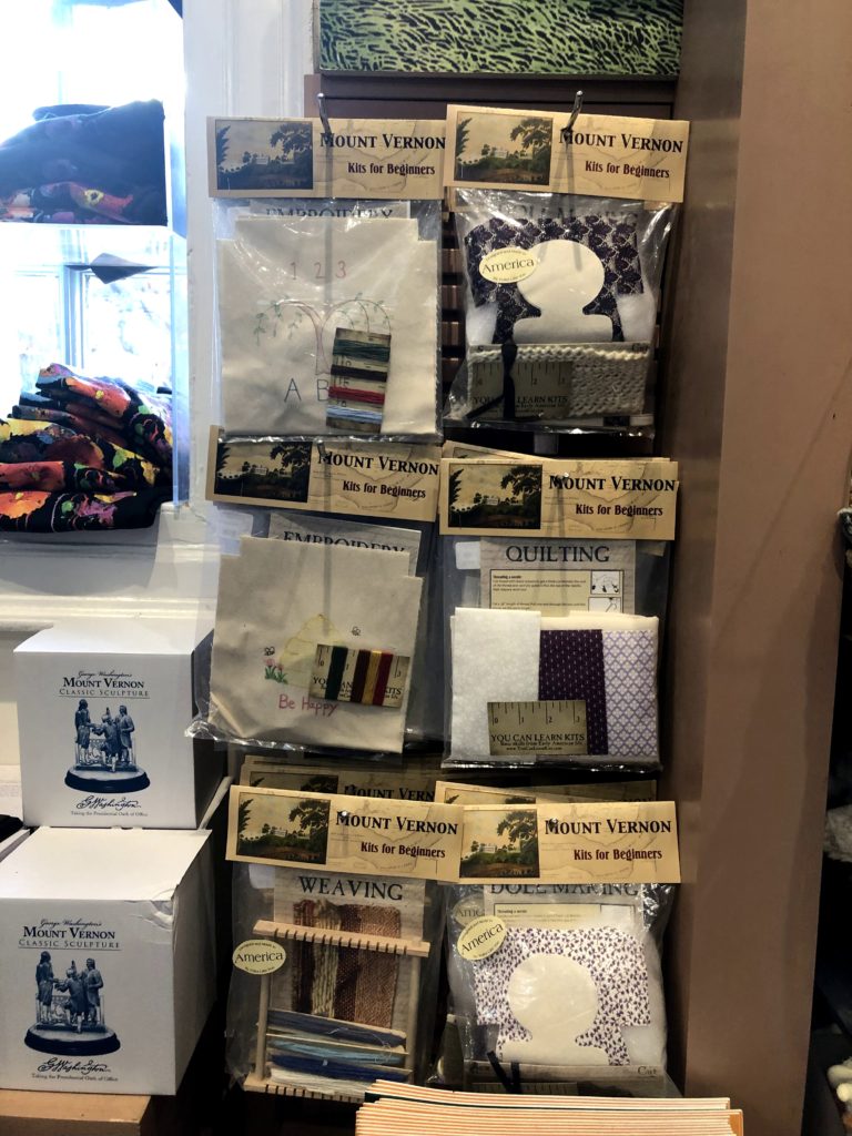 a gift shop display of quilting, embroidery, sewing, and weaving kits