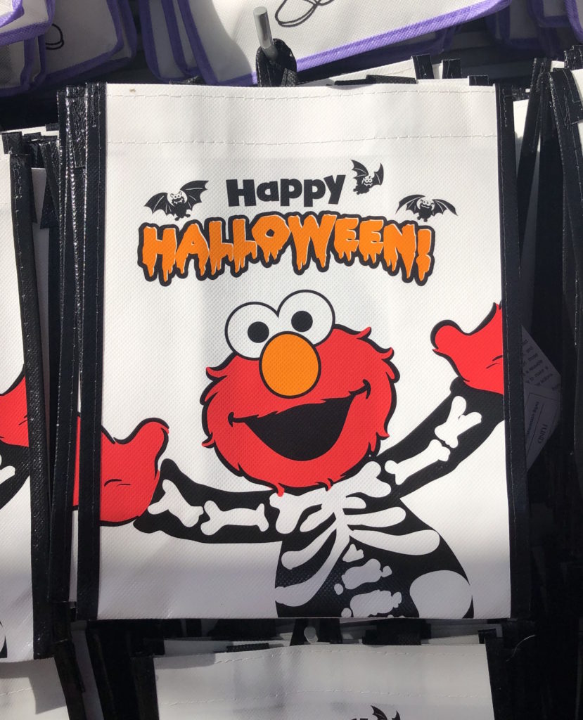 a souvenir bag with Elmo dressed as a skeleton and the text "Happy Halloween"