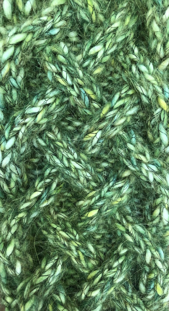 a close-up of the cables on the knitted "braided" headband