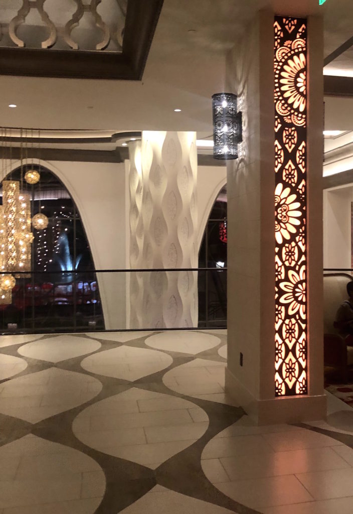 bold geometric tile designs in natural colors and bold floral motifs in the lobby of Disney's Coronado Springs: Gran Destino Tower