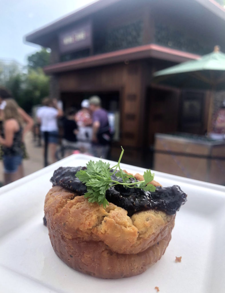 a black pepper Boursin soufflé with fig marmalade, plated with a sprig of parsley