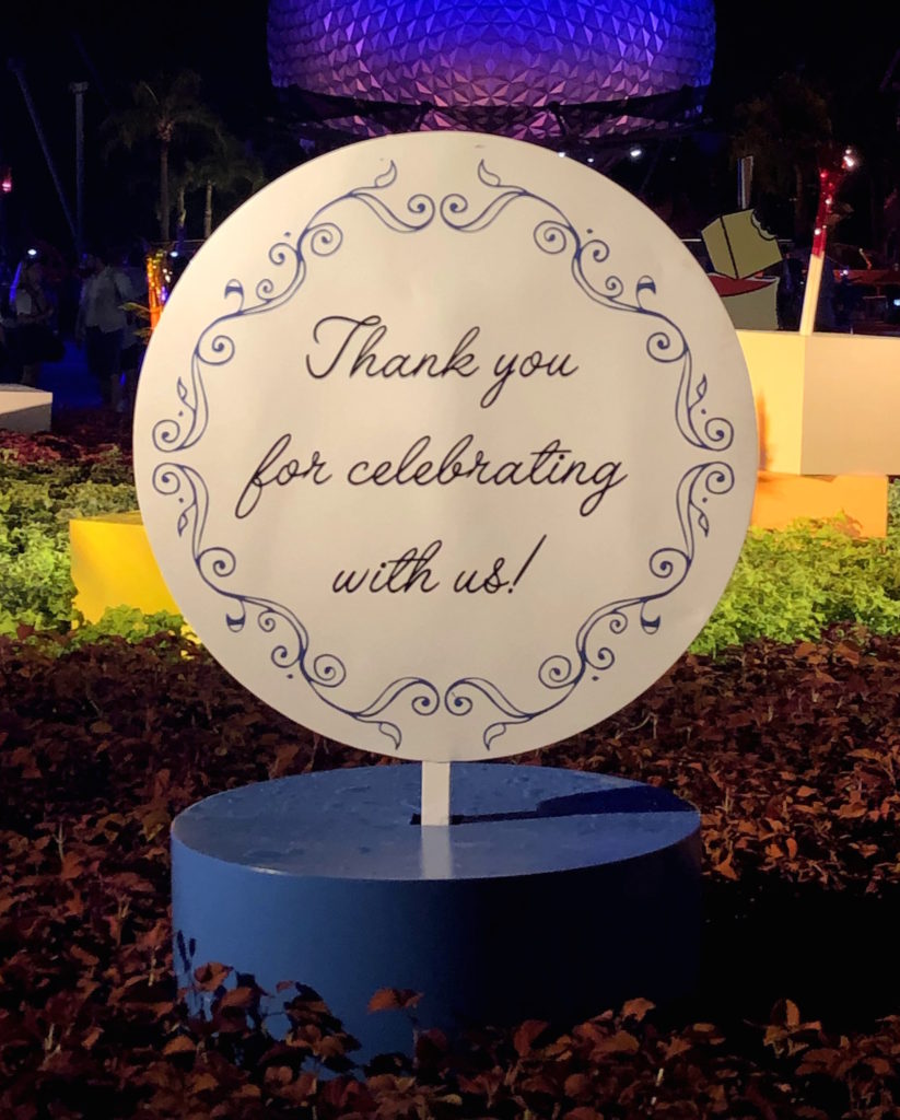 a sign in front of Spaceship Earth at Epcot reads "Thank you for celebrating with us!