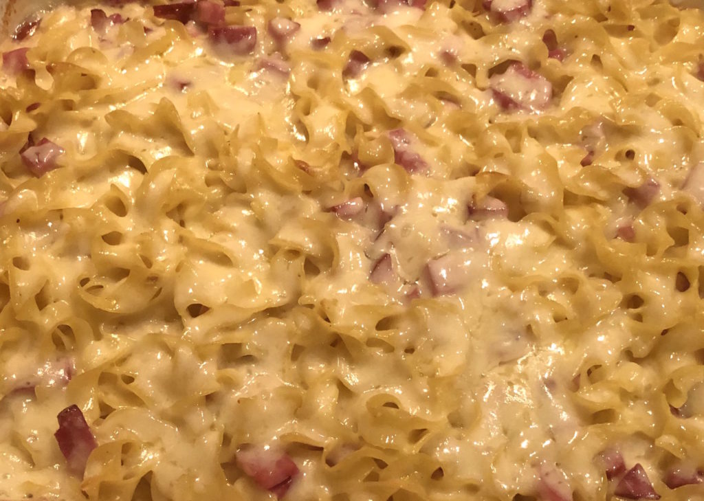 a close-up image of schinkennudeln (ham noodles)