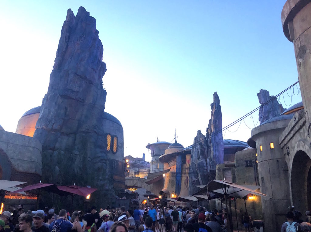 crowds gather in the streets of Batuu at Star Wars: Galaxy's Edge at Disney's Hollywood Studios