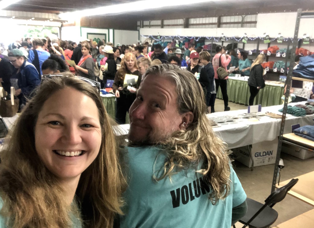 volunteers sell t-shirts in the t-shirt barn