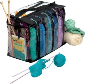 a clear plastic yarn tote with six compartments for different color yarn
