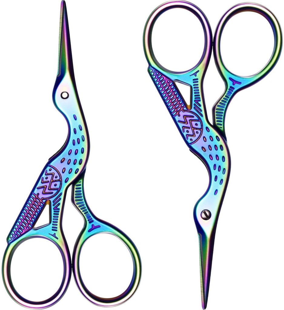 two pairs of scissors shaped like herons