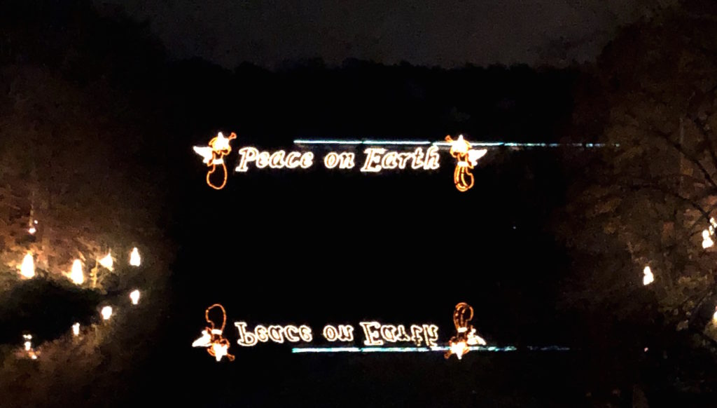 The bridge at Busch Gardens Williamsburg's Christmas Town reads "Peace on Earth" in twinkling lights