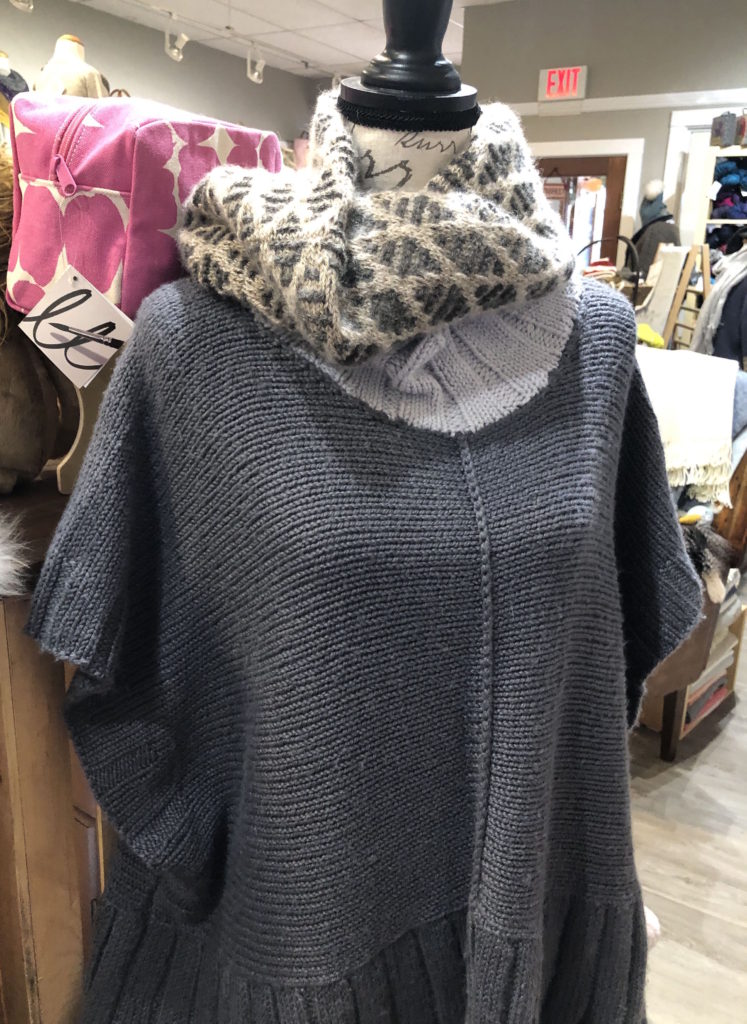 a dressform wearing a handknit sweater and handknit mosaic cowl