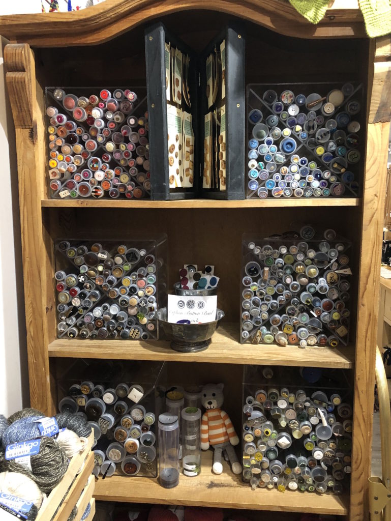 an entire shelf full of buttons