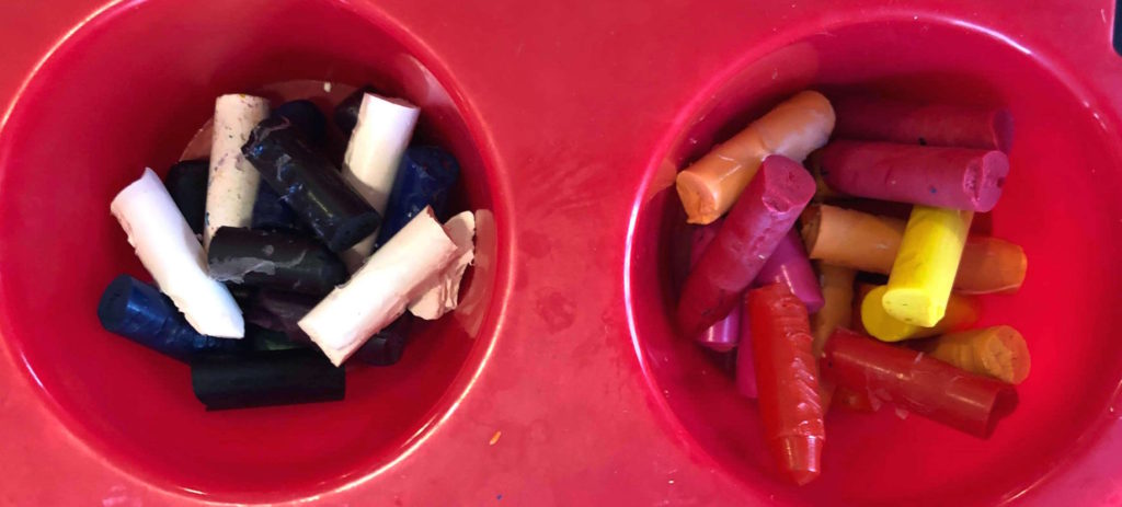 crayon chunks grouped by color in a silicone baking tray