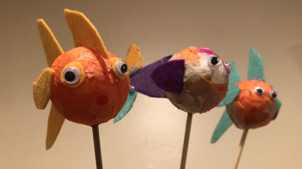 three foam ball fish on dowels with bug eyes