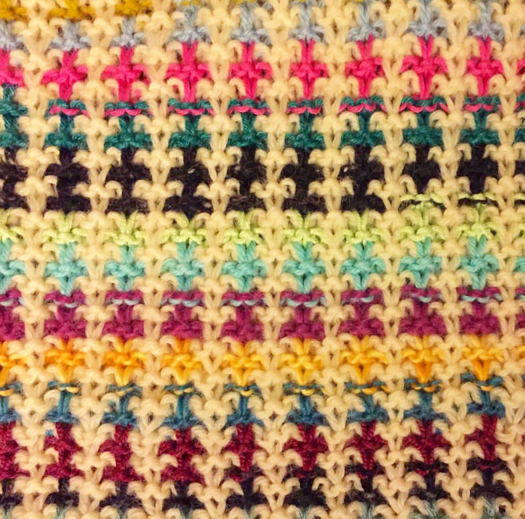 a close-up of a multi-colored stitch pattern