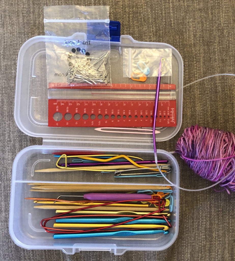a kit of notions: knitting needles, pins, stitch markers, stitch holders, cable needles, crochet hooks, needle gauge, and finishing needles
