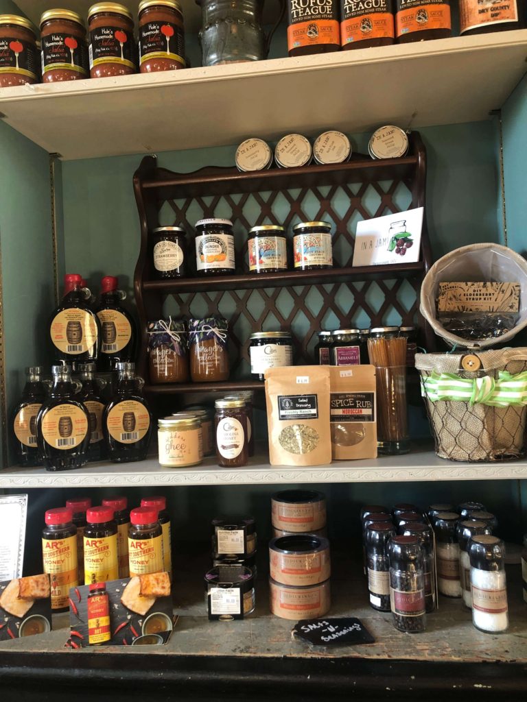 syrups, honey, and james line the shelves