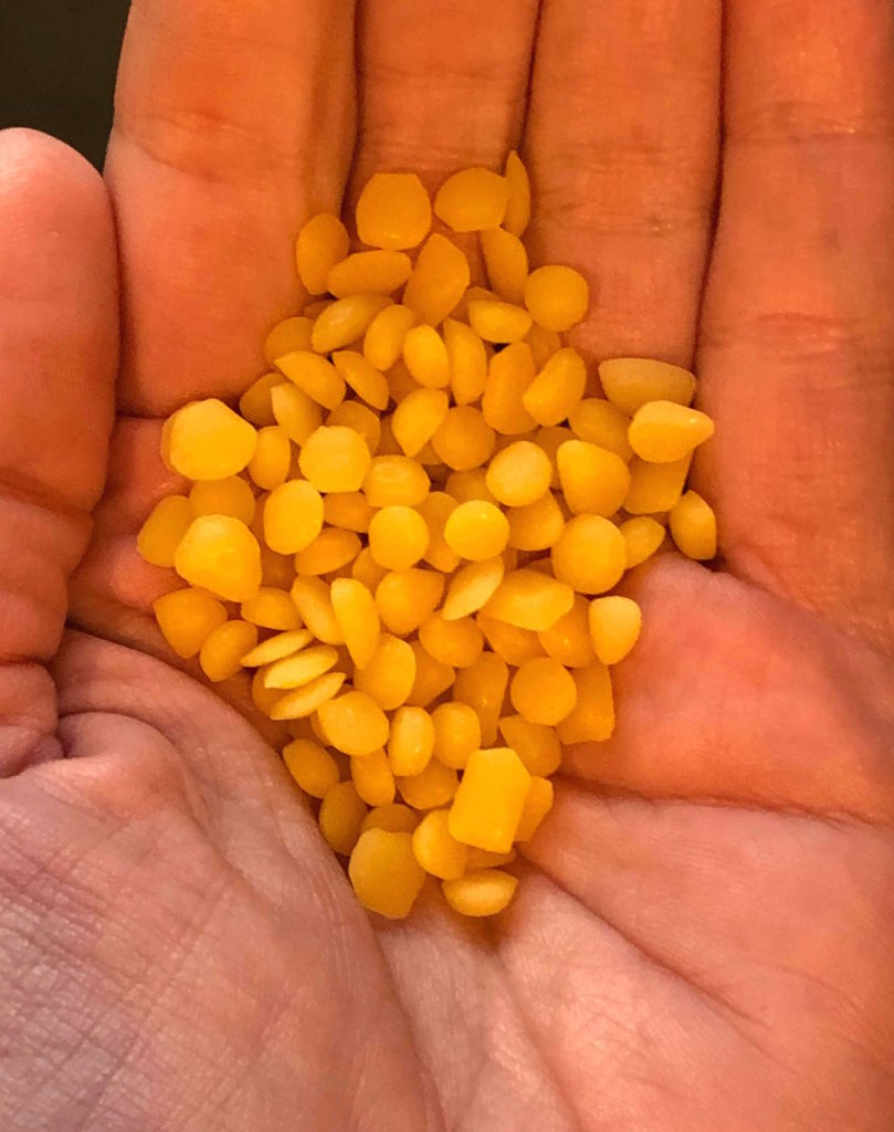 a handful of beeswax pellets