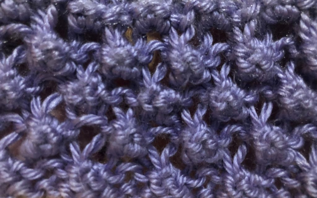 a close-up of Blackberry Stitch worked in Caron Simply Soft yarn (colorway: Lavender Blue)