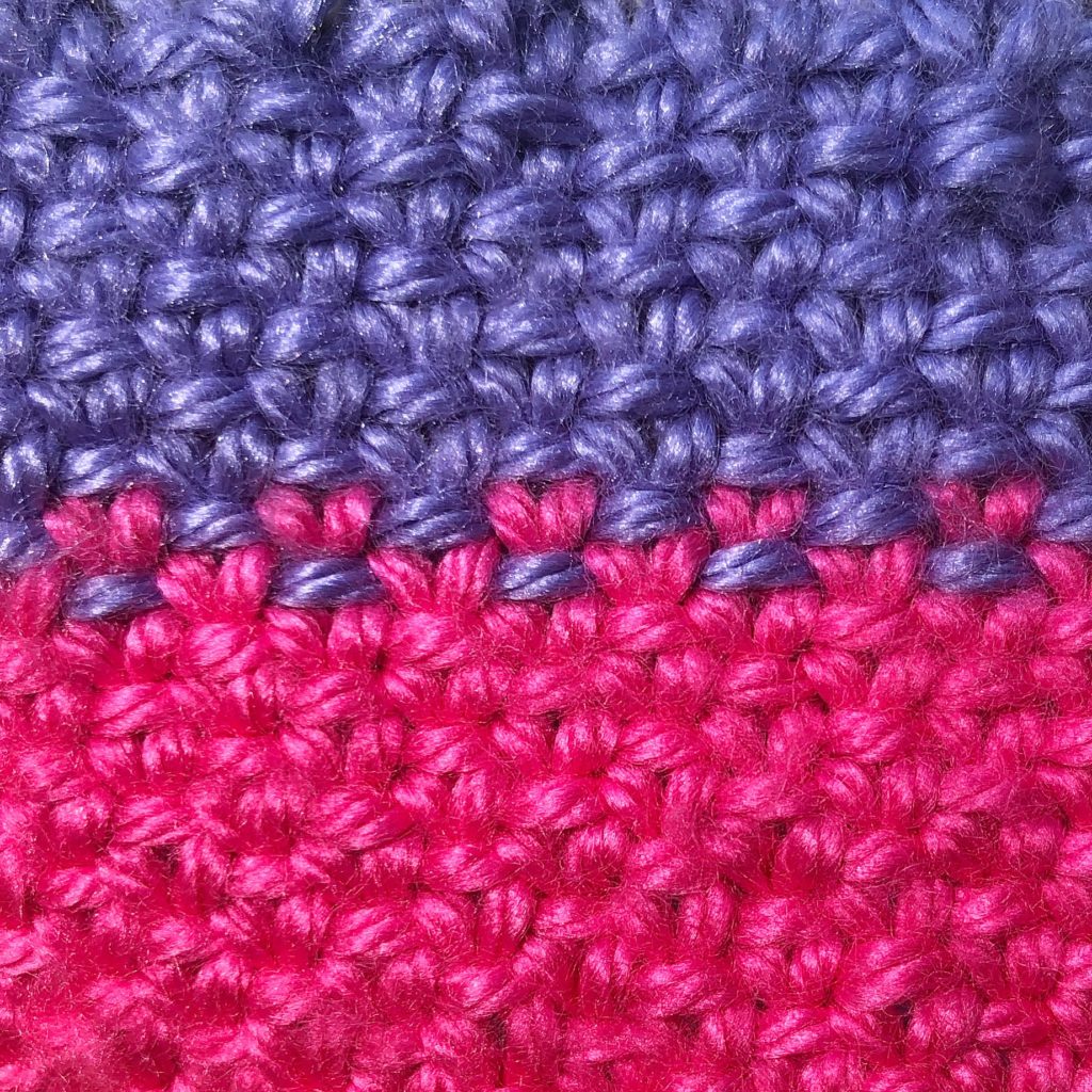 a close-up of the linen stitch worked in alternating colors
