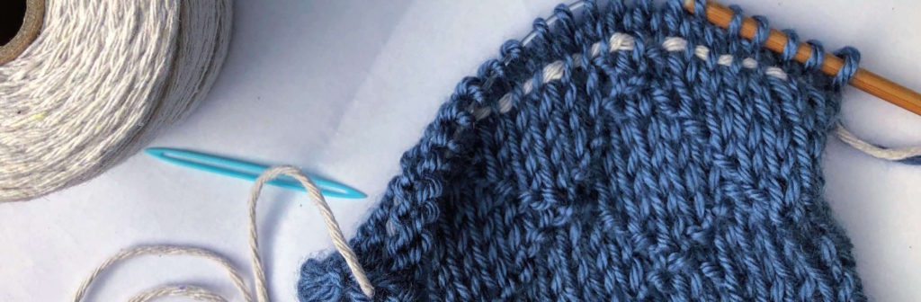 an image of knitting in progress with a lifeline in use