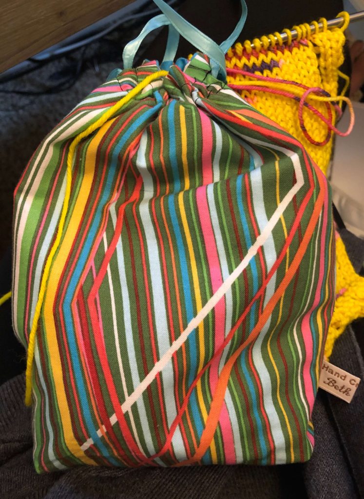 a multicolored stripe project bag