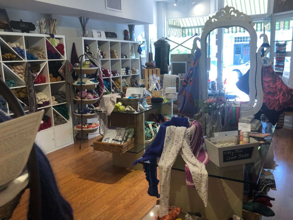 House Mountain Yarn Co interior: shelves and baskets of yarn