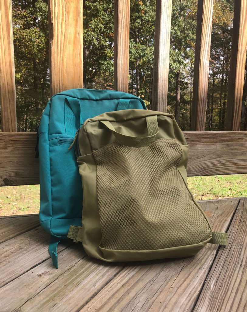 two small backpacks with handles and multiple pockets