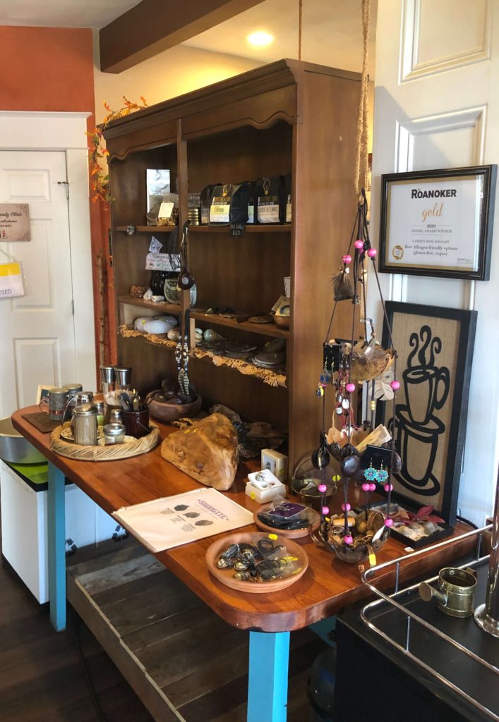 a wooden table serves as a tea and coffee service station