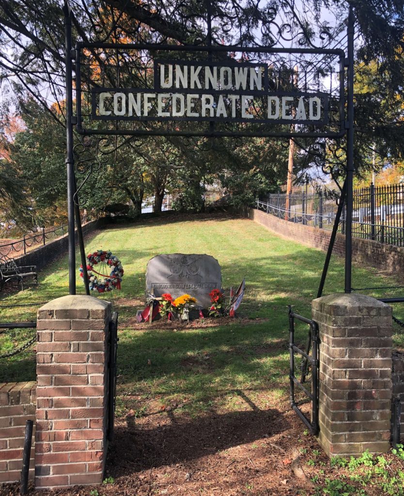 A fenced-in cemetery at Sinking Spring Cemetery in Abingdon, Virginia, bears a wrought-iron and brick sign that reads "Unknown Confederate Dead."