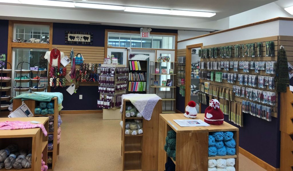 walls of needles and notions at Knitting Addiction