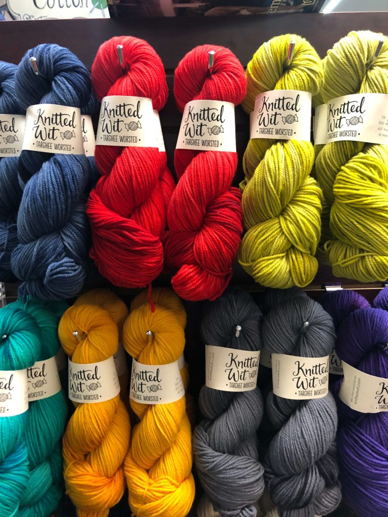 several brightly-colored solid hanks of yarn from Knitted Wit
