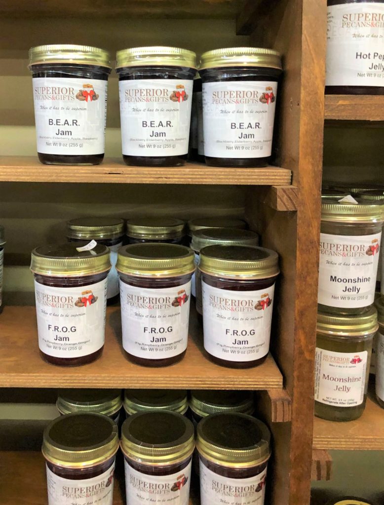 jelly and jam jars full of BEAR jam, FROG jam, moonshine jelly, and hot pepper jelly line the shelves