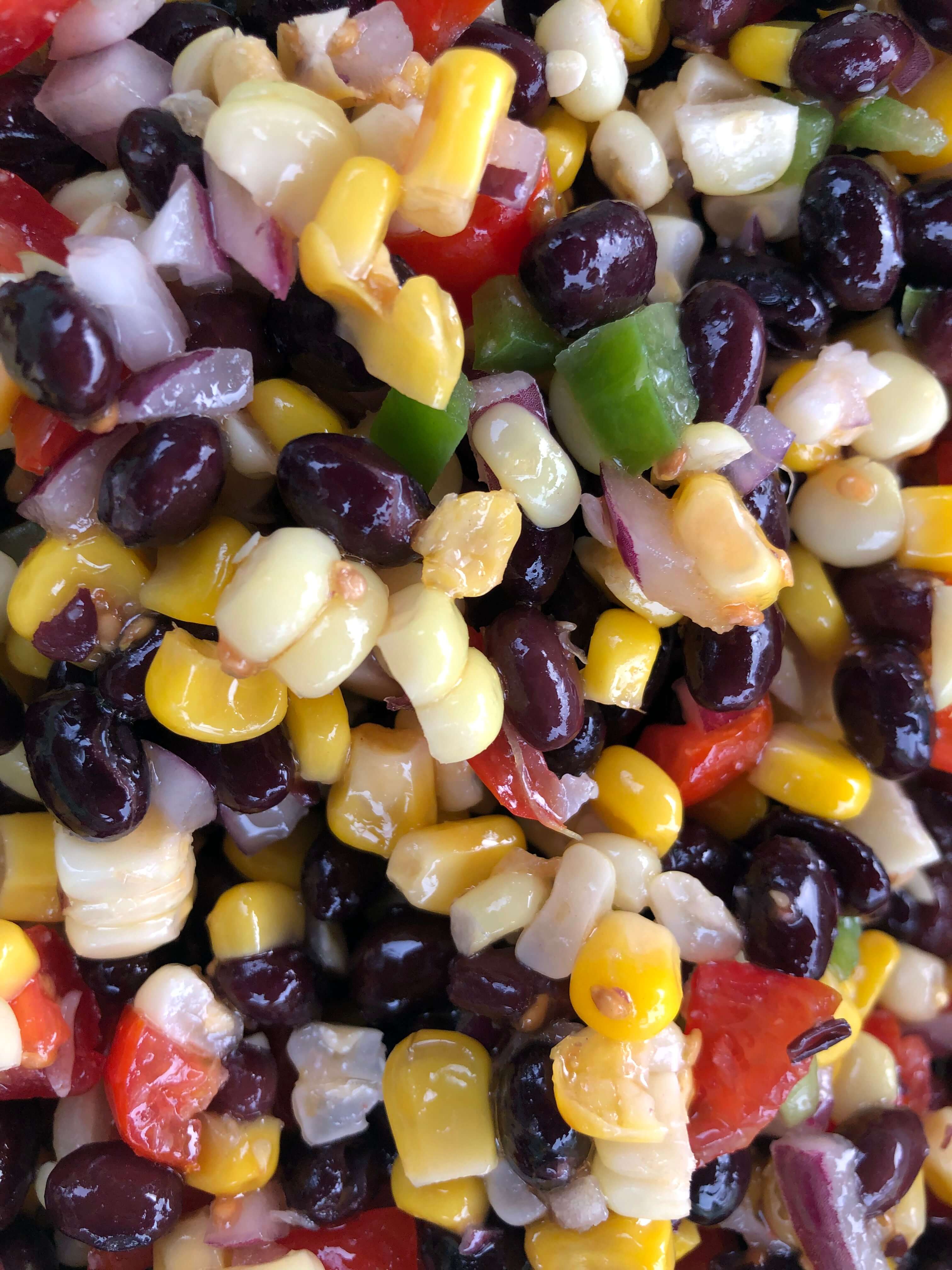 a close look at salsa made from black beans, corn, red onions, green peppers, and tomatoes