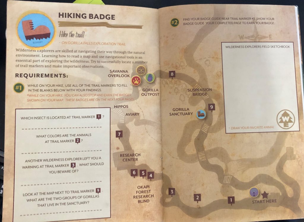 an example of a page in the Wilderness Explorers handbook reads "Hiking Badge" and explains the requirements for the badge