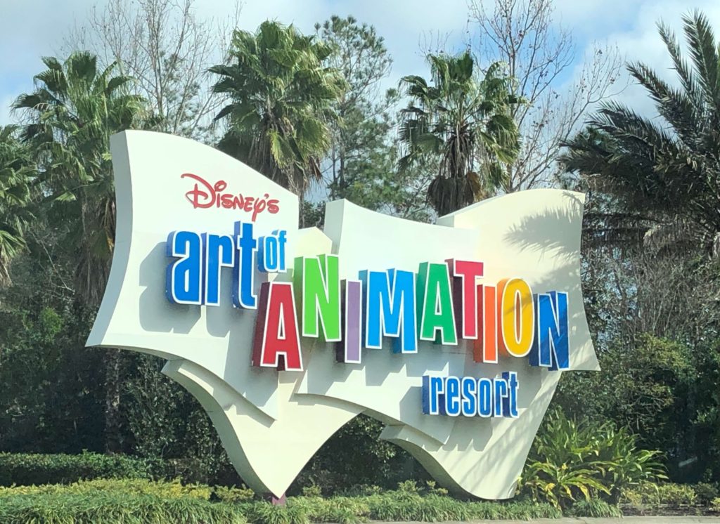 a large sign welcomes visitors to Disney's Art of Animation Resort