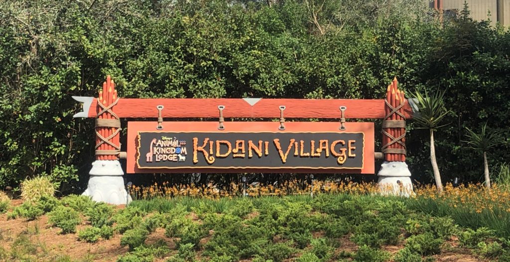 the sign for Animal Kingdom Lodge Kidani Village is made of bamboo posts tied together with rope