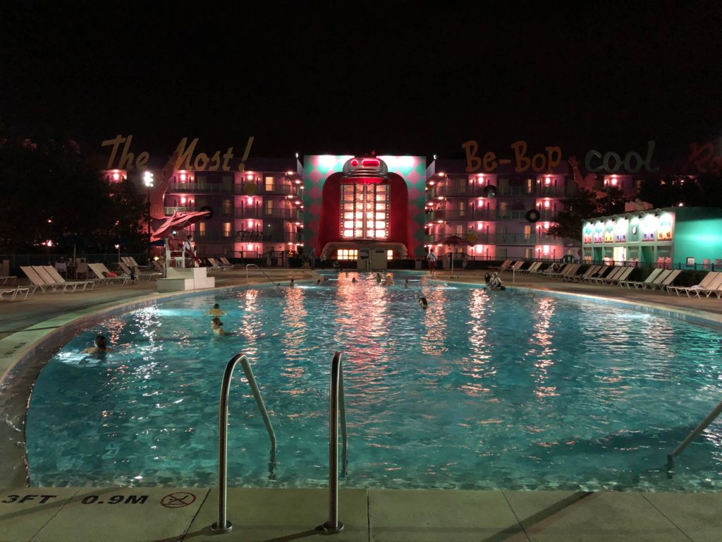 a nighttime view of the bowling pin-shaped pool from the bottom of the pin
