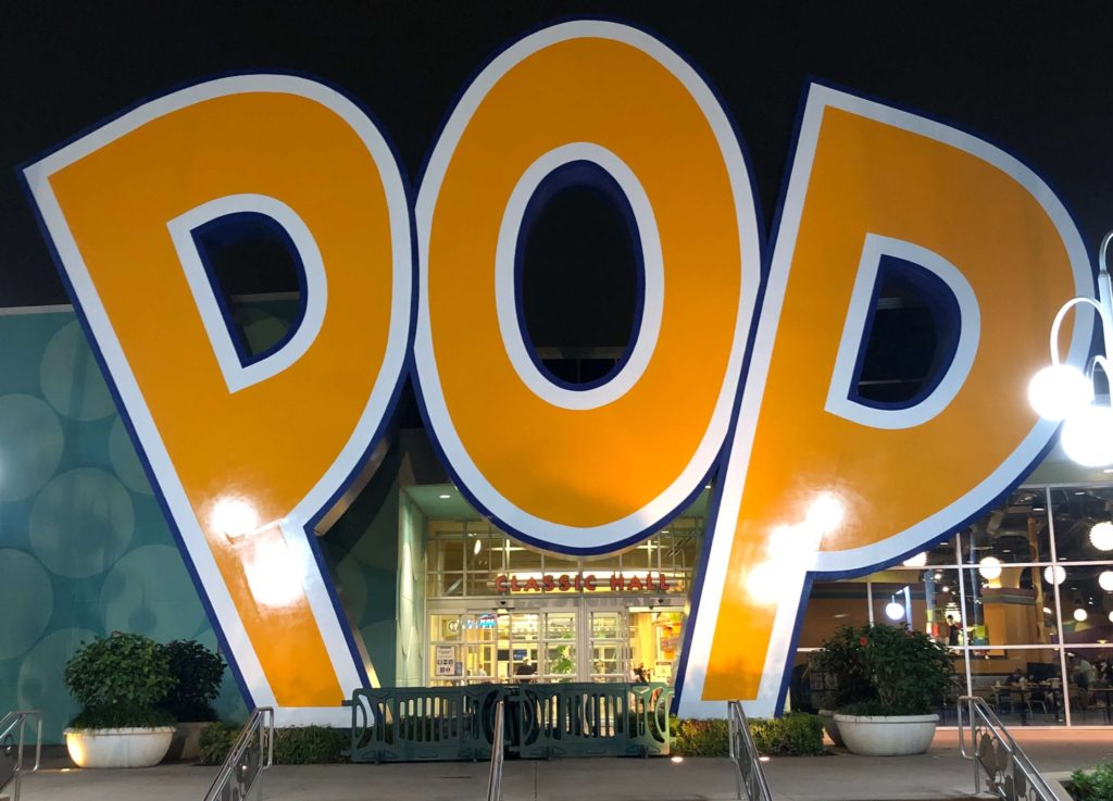a three-story sign reads "POP" just above the entrance to Classic Hall