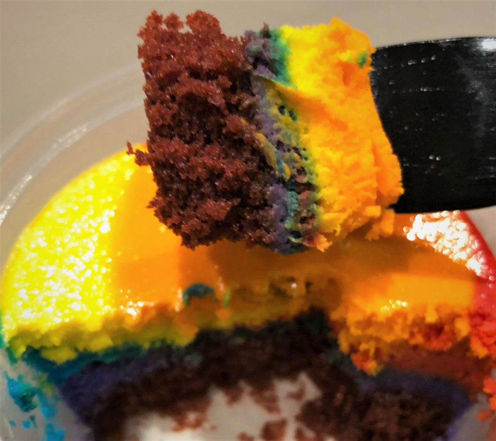 a close-up of the red velvet under layer of the tie dye cheesecake at Disney's Pop Century resort