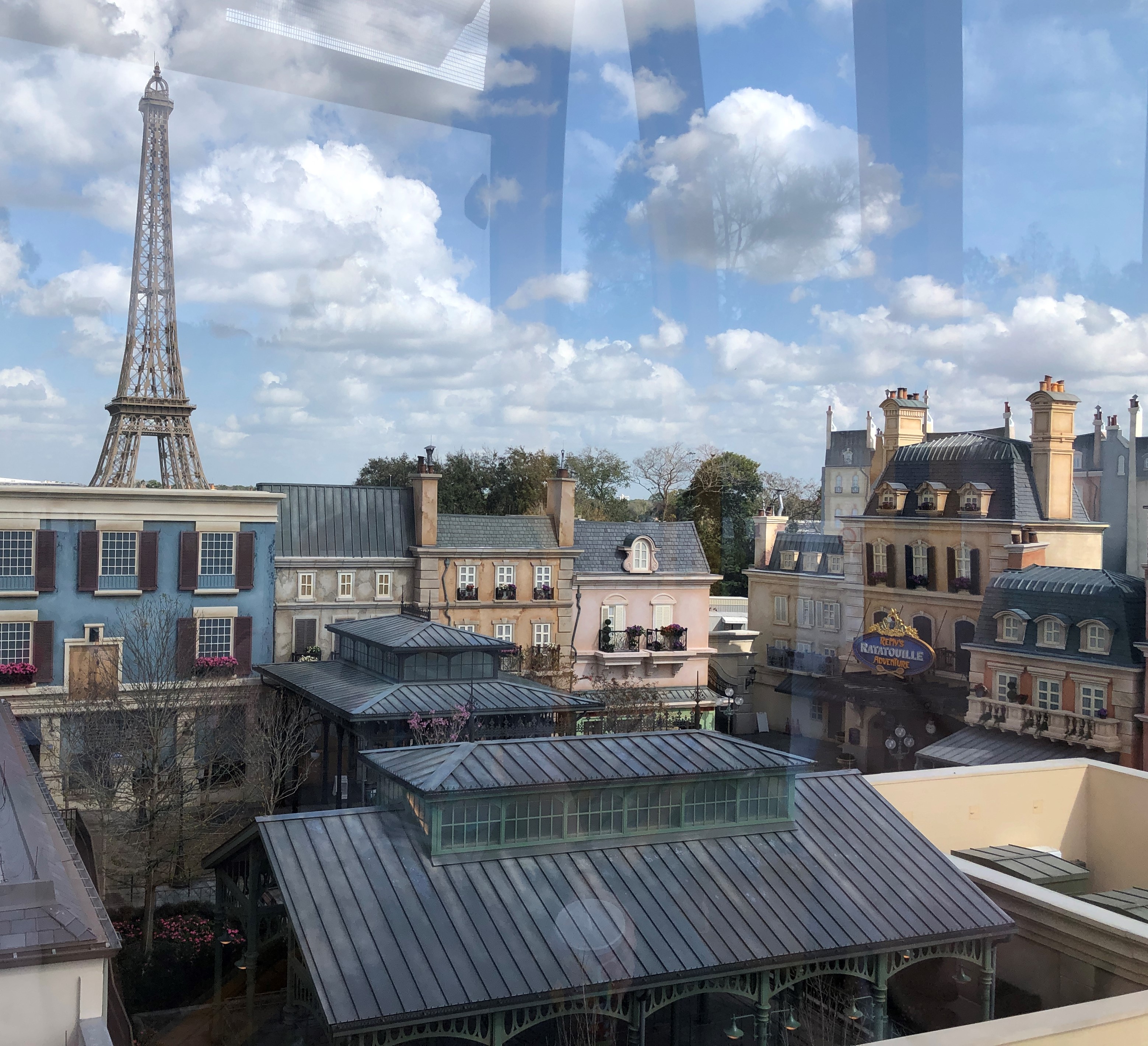 a view of France in Epcot from a the window of a Skyliner gondola