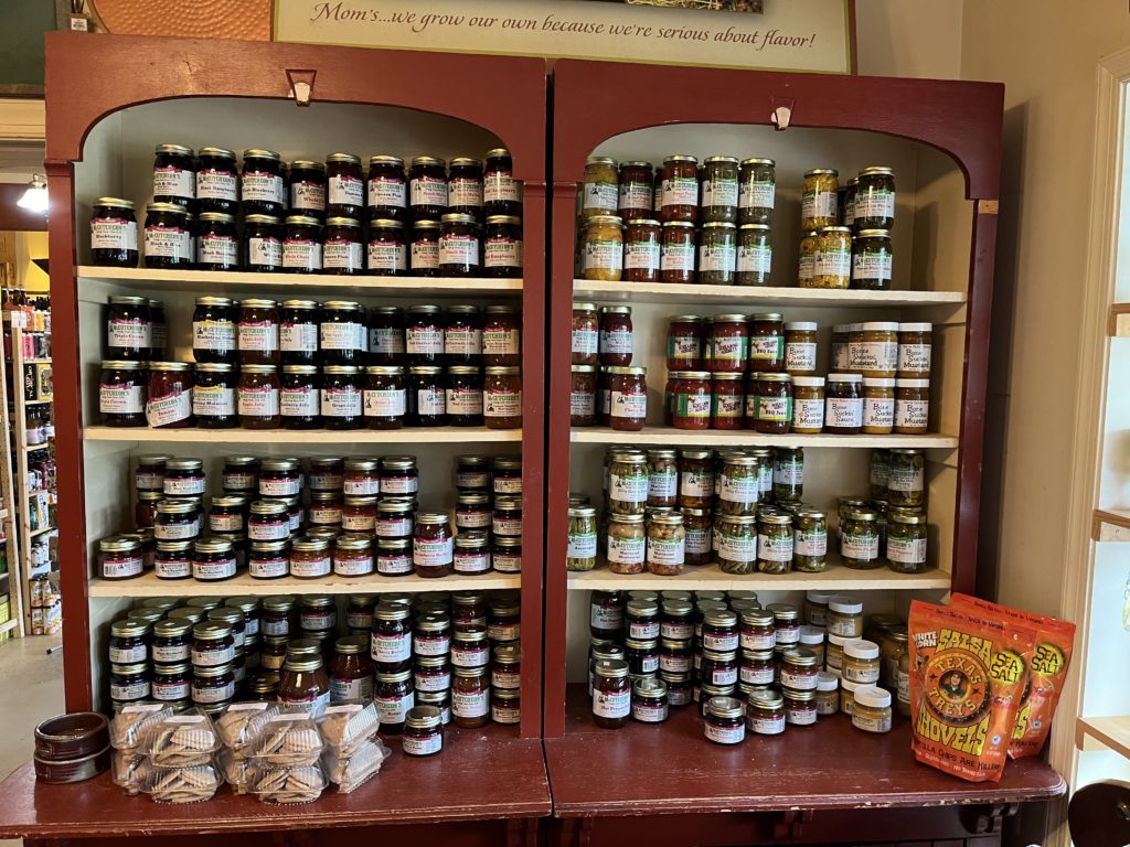 a shelf of jellies, jams, and mixes at Mom's Apple Pie Co.
