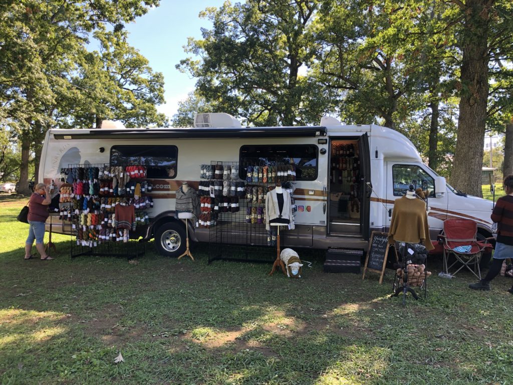 a large truck full of yarn sets up shop at the Shenandoah Valley Fiber Festival
