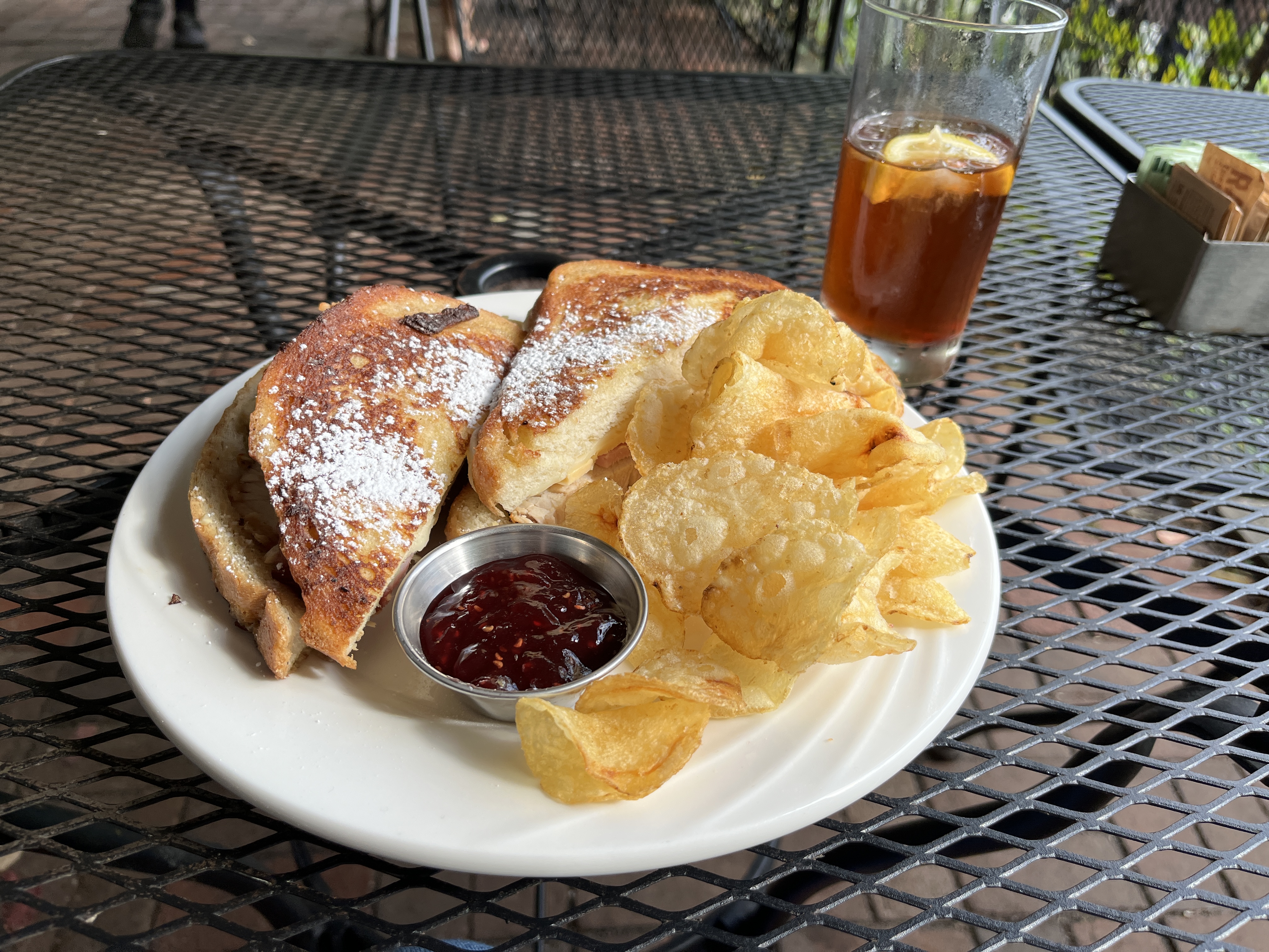 a Monte Cristo sandwich, chips, raspberry jam, and iced tea at The Secret Garden Café