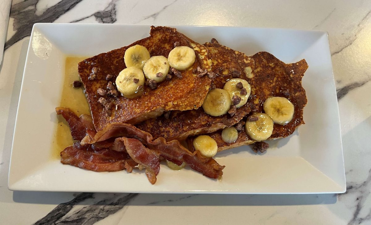 Bananas Foster French Toast from Clifton Café: French toast with bananas, candied pecans, caramel syrup, and a side of bacon