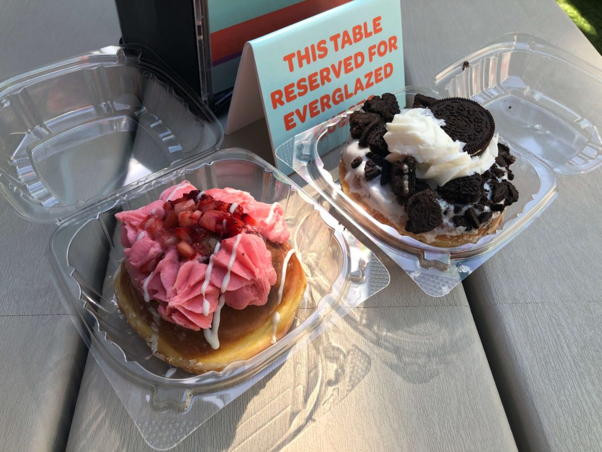 Donuts topped with strawberries and Oreos on a table reserved for patrons of Everglazed Donuts & Cold Brew 
