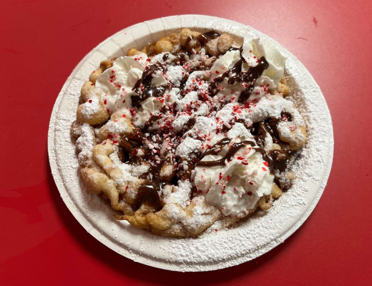 the Candy Cane Funnel Cake at Kings Dominion WinterFest features crushed candy canes and chocolate drizzle