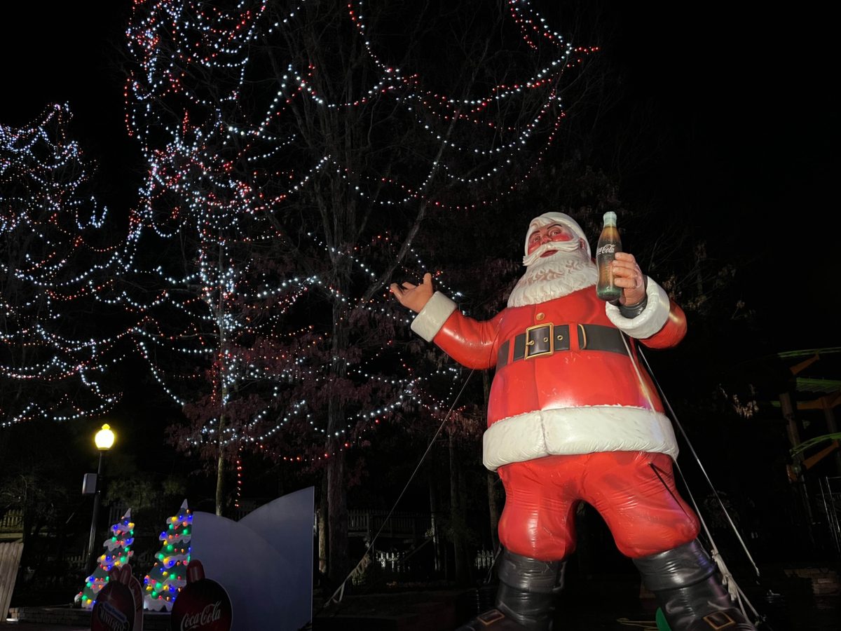 an inflatable Santa towers over guests at Kings Dominion WinterFest