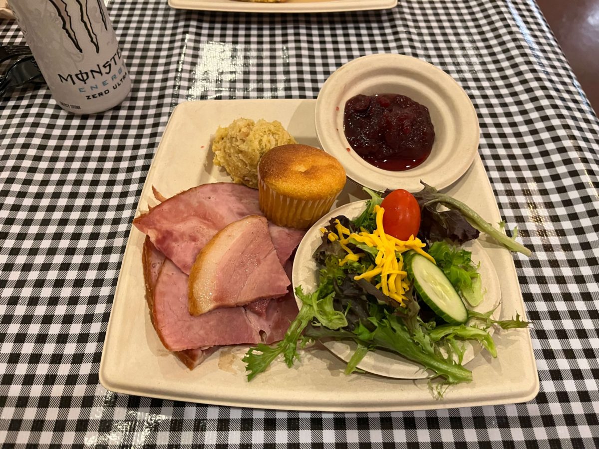 a holiday dinner at Kings Dominion WinterFest features ham, cornbread stuffing, cranberry sauce, cornbread, and a side salad