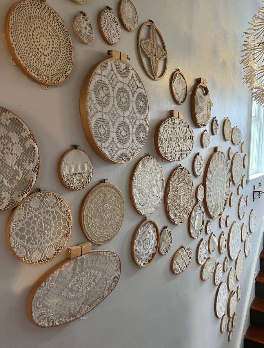 knitted, crocheted, and sewn doilies on the wall at Finch Knitting + Sewing Studio