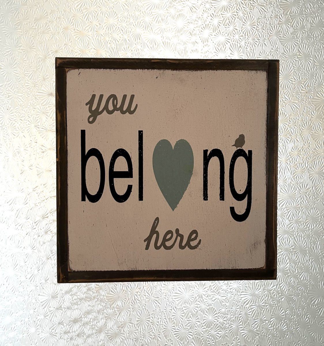 a sign reads "You Belong Here" at Finch Knitting + Sewing Studio