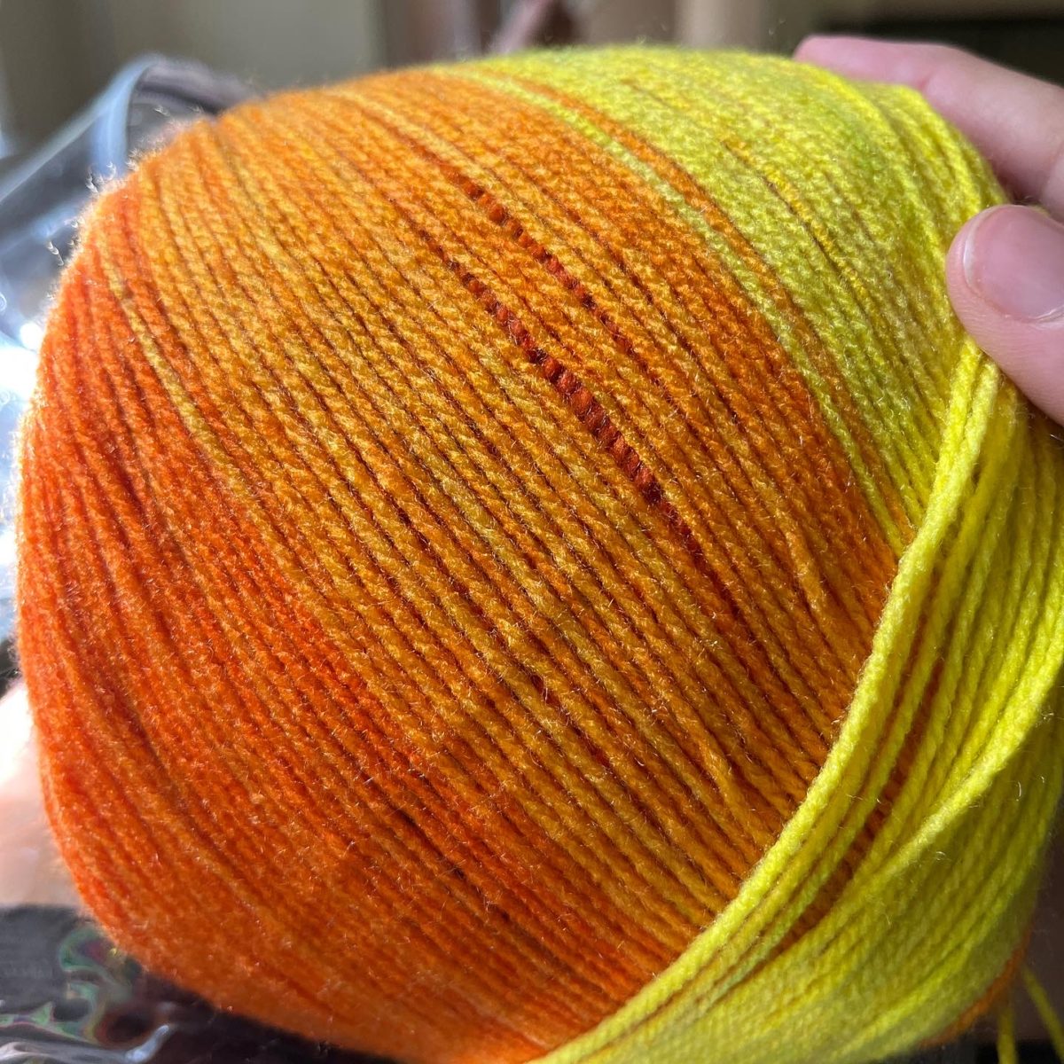 a cake of rainbow yarn: Caron Skinny Cakes yarn in Rainbow